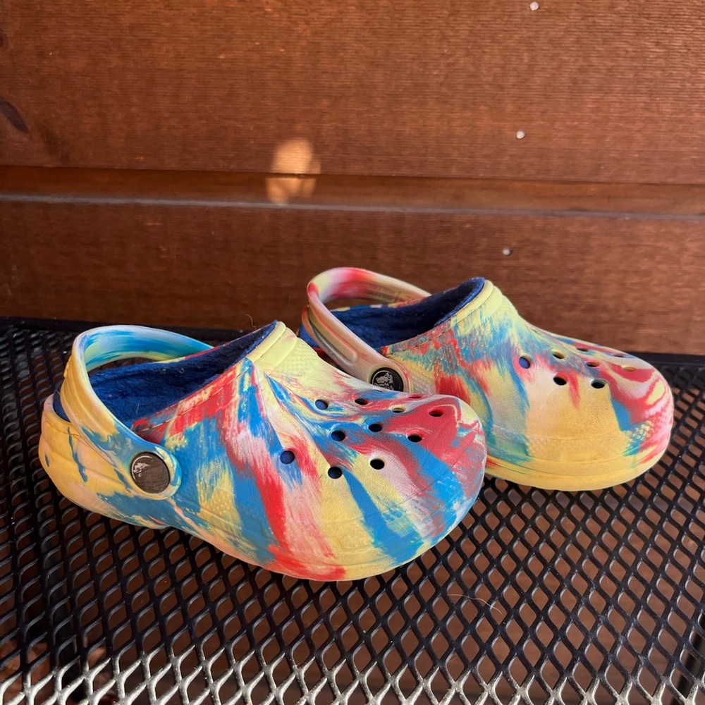 Fleece lined CROCS - yellow, red, blue marble swirl. Toddler size 9.
